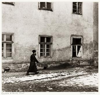 ROMAN VISHNIAC (1897-1990) Cracow, A Jewish Street * Munkatch. Baruch Rabinovitch examining the Yeshiva Bahurim * Munkatch. The Beltser